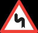 Double bend, first to left road sign from Switzerland