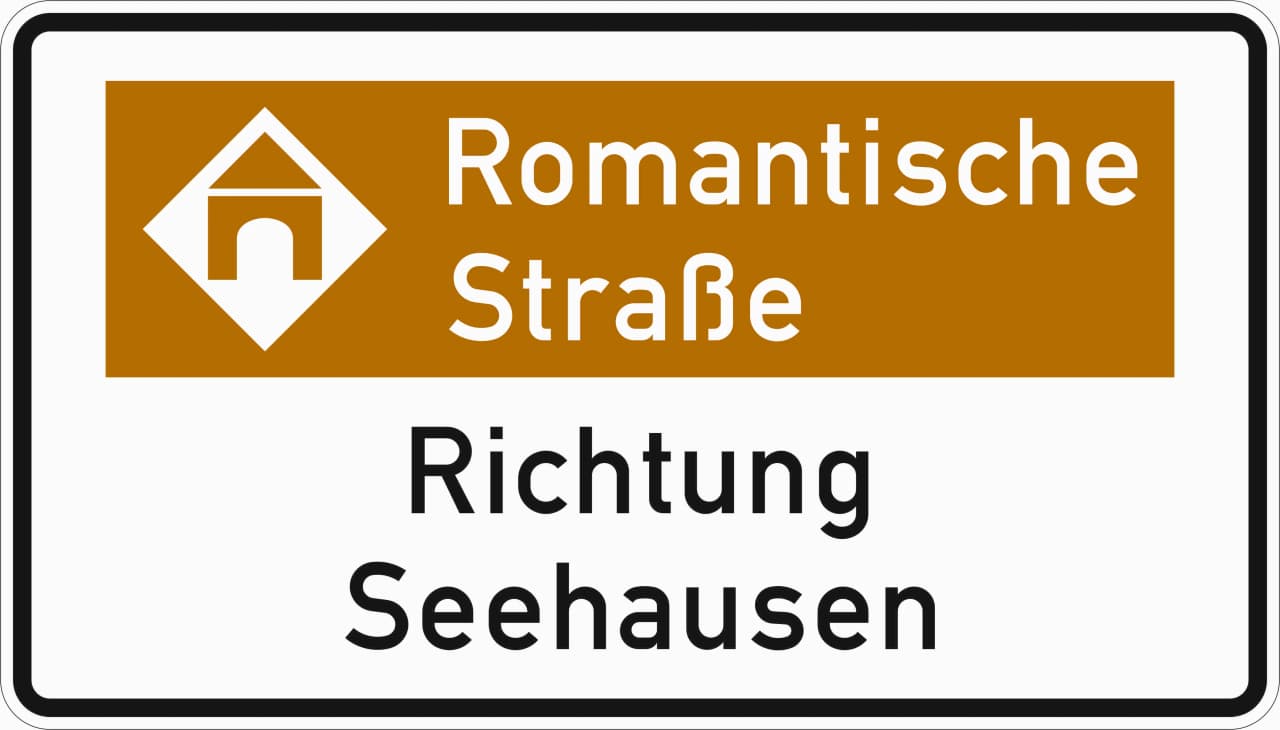 386.2-52 - Touristische Route – Hinweis mit Bezugsziel, Variante „Richtung“ Verkehrsschild